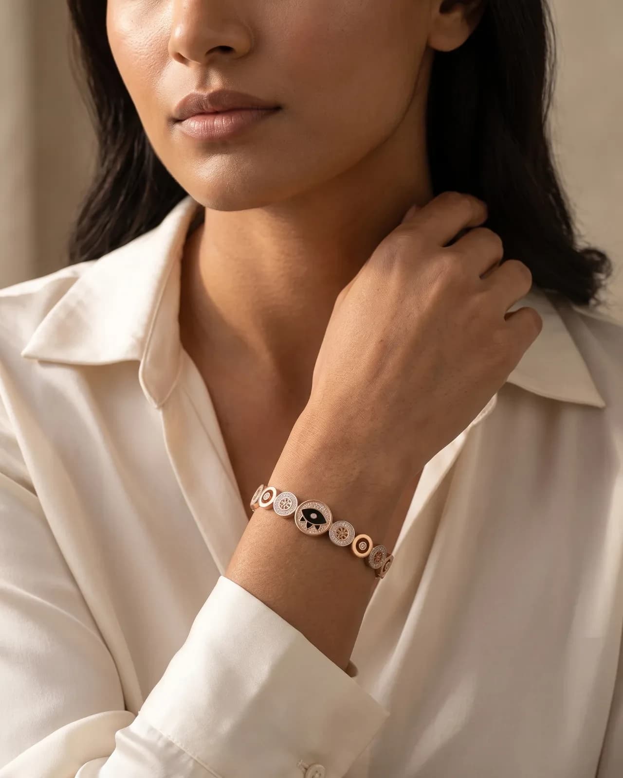Front view of Élise Protection Bangle showing the evil eye and circular motifs
