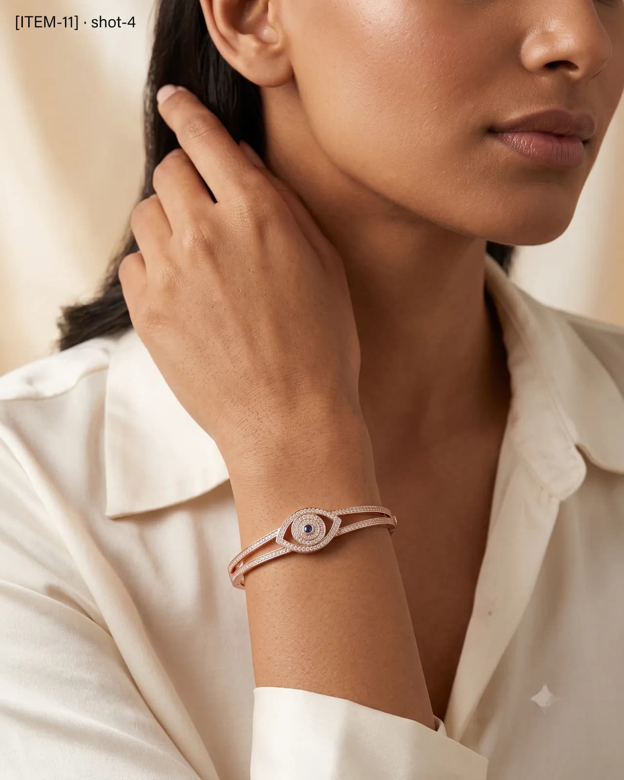 Front view of Solène Eye Cuff featuring the stone-encrusted eye motif