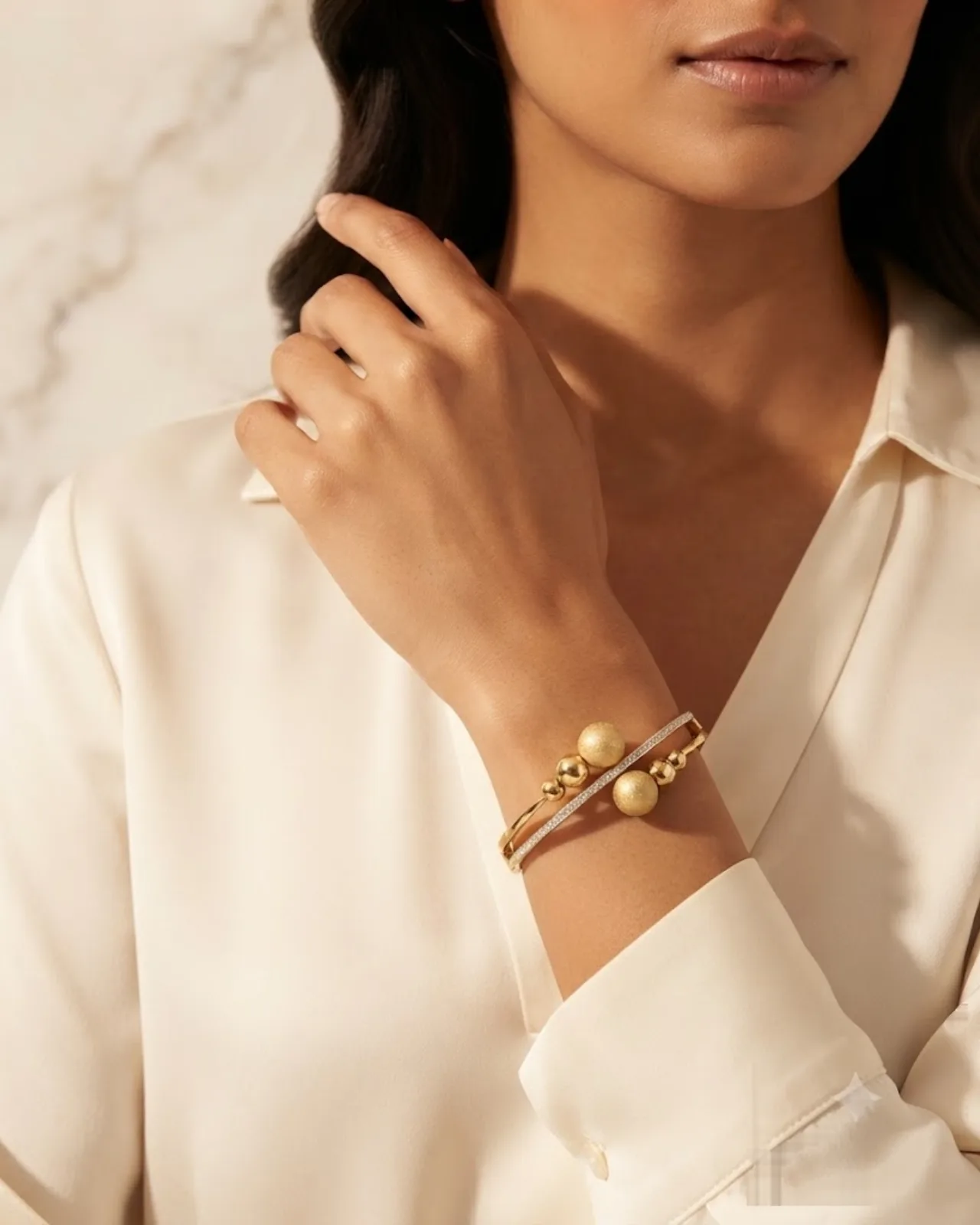 Lucille Sphere Cuff bracelet resting on a marble surface